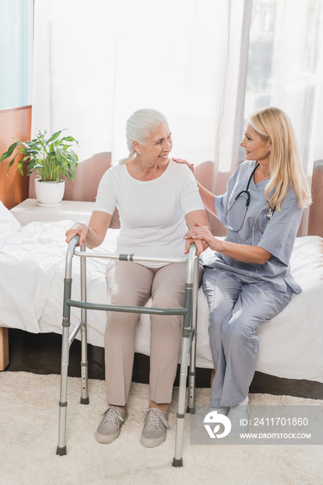 nurse and senior patient with walker