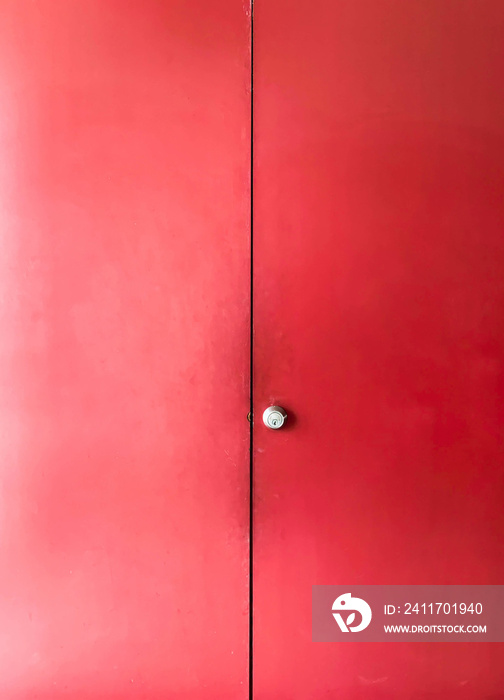 An ancient red ancient door towering powerfully. retro red door. vintage door.