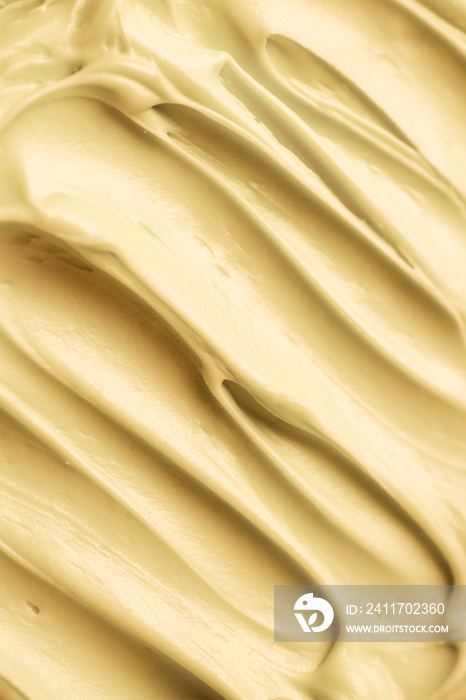 Yellow icing frosting close up texture