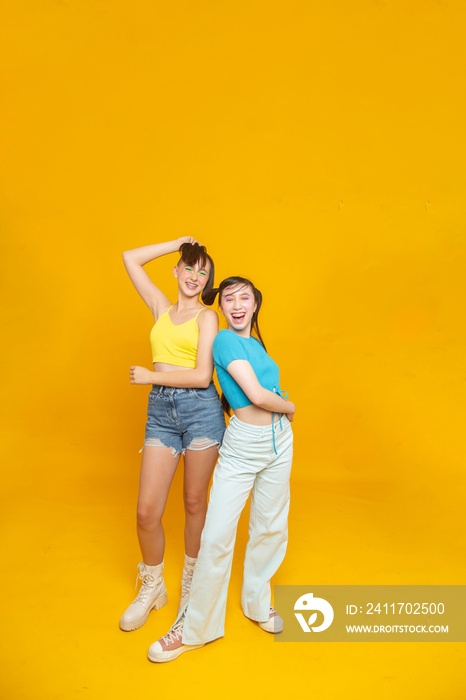 Studio portrait of smiling stylish friends