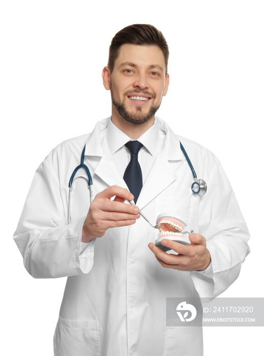 Handsome dentist standing on white background