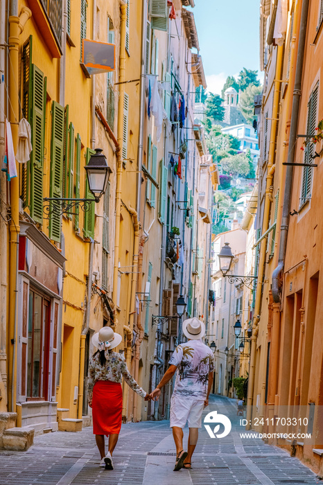 Menton France,couple men and woman on vacation at the Cote d Azur France, View on old part of Menton, Provence-Alpes-Cote d’Azur, France Europe