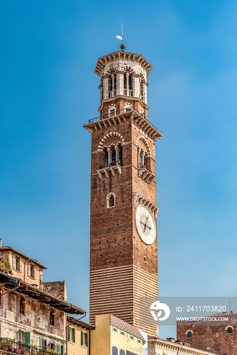 Torre dei Lamberti, an 84 m high tower in Verona, northern Italy, built in the 12th century in Romanesque-Gothic style, seen from Piazza delle Erbe.