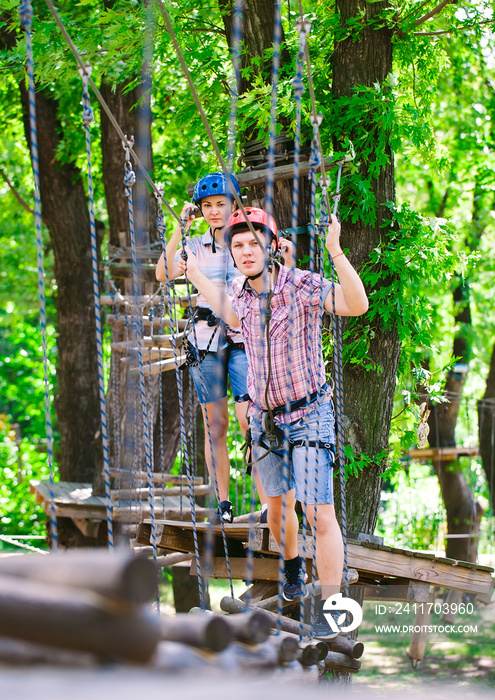 adventure climbing high wire park - people on course in mountain