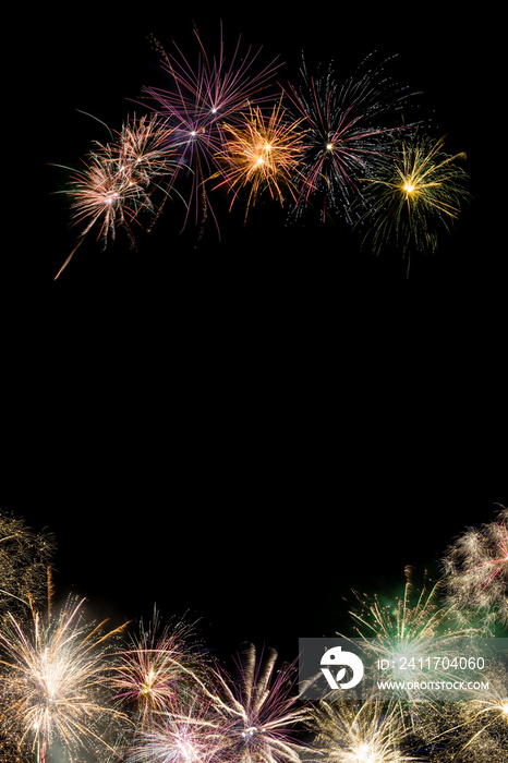 Colored fireworks on black background copy space