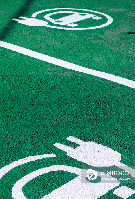 Fresh painted electric car parking place , with a EV Logo design on the floor