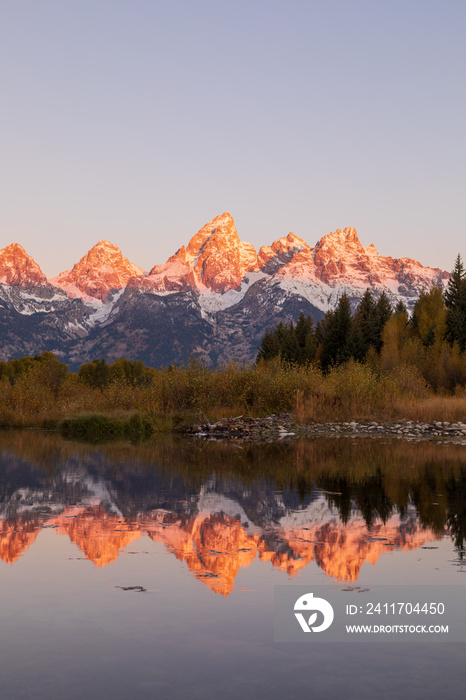 Scenic Sunrise Reflection in the Tetons in Autumn