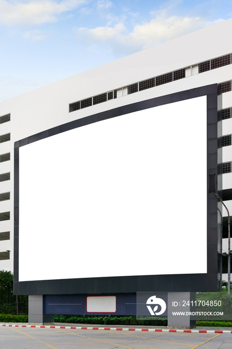Blank advertising billboard LCD advertisement for adjust your message at modern building in the city with nice sky , mock up selective focus with clipping path.