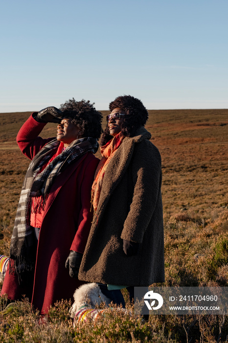 Two senior women hiking in landscape