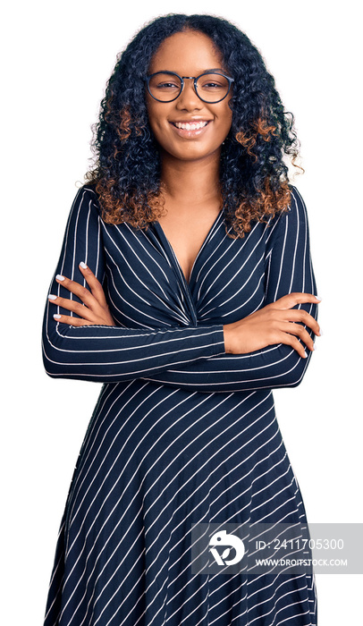 Young african american woman wearing casual clothes and glasses happy face smiling with crossed arms looking at the camera. positive person.