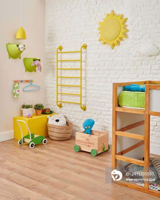 Decorative baby room corner style with toy bed and object decor.