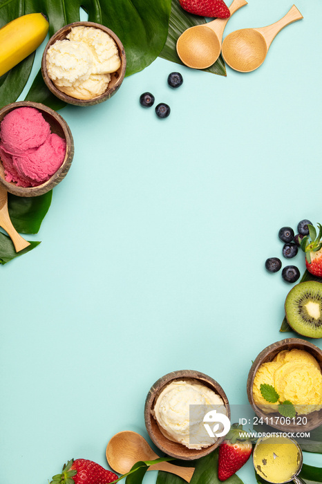 Tropical fruits and plants with variety of ice cream in coconut shells