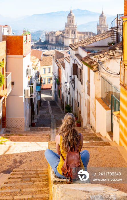 Woman tourist looking at cathedral of Jaen in Spain