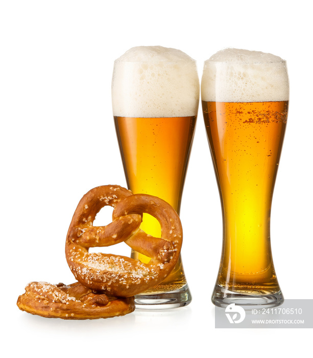 Glasses of fresh beer and pretzels on white background. Oktoberfest celebration
