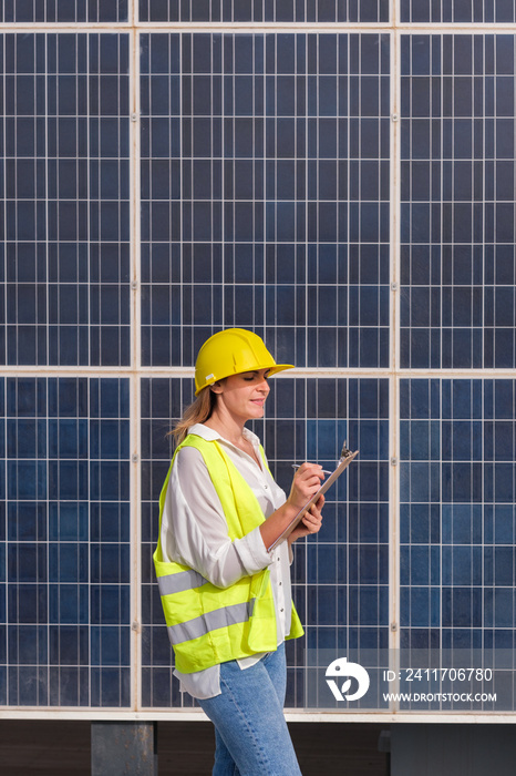 Young woman collecting data on renewable energy