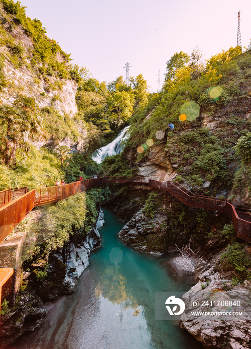 Bellano gorge (Orrido di Bellano) with walkways for tourists, flare
