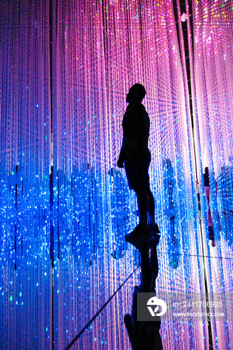 Man in illuminated abstract illuminated a futuristic world
