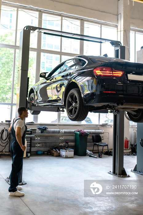 Car technician preparing the client auto for visual inspection