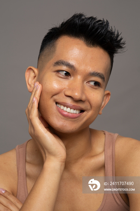 Studio portrait of smiling person