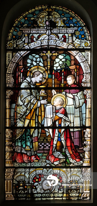 Saint Aloysius is given his first communion by Saint Charles Borromeo, stained glass window in the church of Saint Martin in Zagreb, Croatia