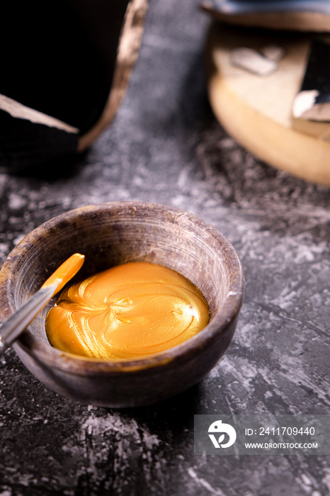 Bowl with a golden ointment to repair a pottery for the practice of kintsugi art.