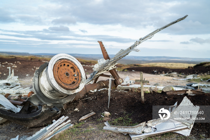 Abandoned B29 WW2 American AS Airforce Bomber Overexposed crash site on Bleaklow Moor with rusty aircraft engine parts and aeroplane landing gear wheels wreckage strewn across Peak District landscape