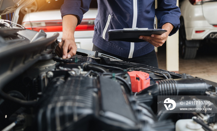 Automobile mechanic repairman hands repairing a car engine automotive workshop with a wrench, car service and maintenance,Repair service.