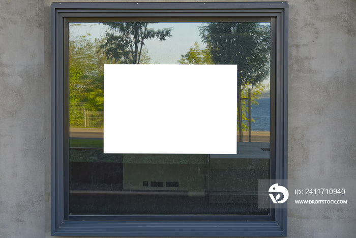 white advertising sticker on the window. well suited for real estate listings. Blank billboard and outdoor advertising. Mockup poster outside.