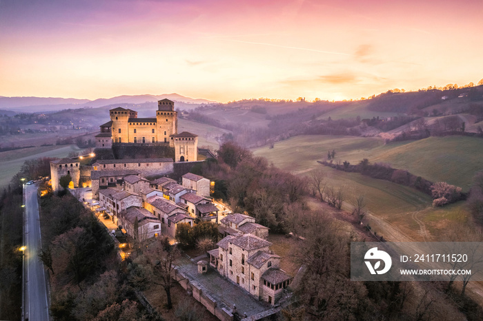 Panoramic aerial view of Torrechiara Castle during winter sunset. Parma, Italy.