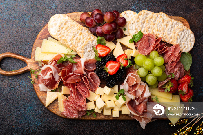 Charcuterie board with variety of cheese and meat