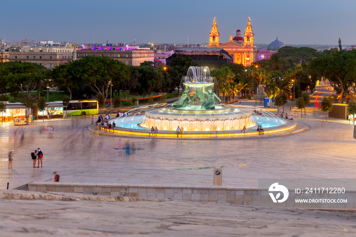 Malta. Triton Fountain at sunset.