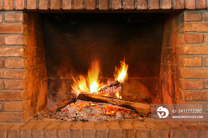 Fireplace with red bricks and fire