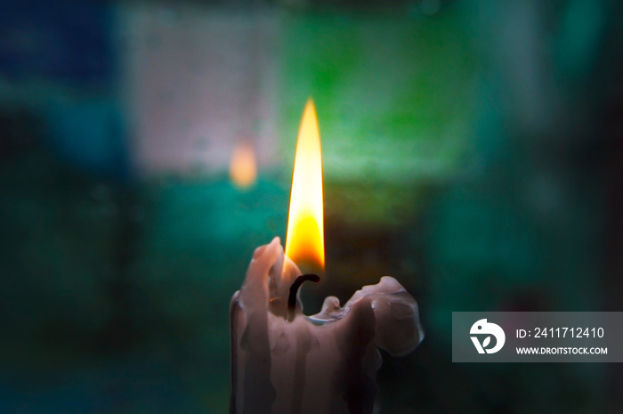 Lonely candle on a blurred background