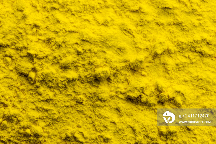 Close up of yellow powder background, with copy space