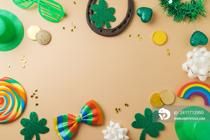 St Patrick’s day holiday frame border background with lucky charms, shamrock and  rainbow. Top view, flat lay