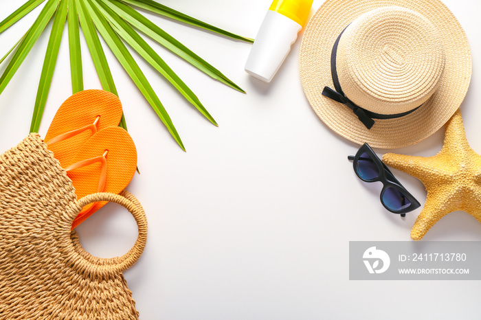 Summer composition with beach accessories on white background