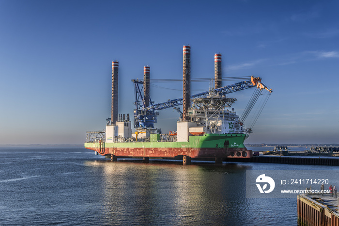 Vessel for supporting wind power turbines setup in Esbjerg harbor in Denmark