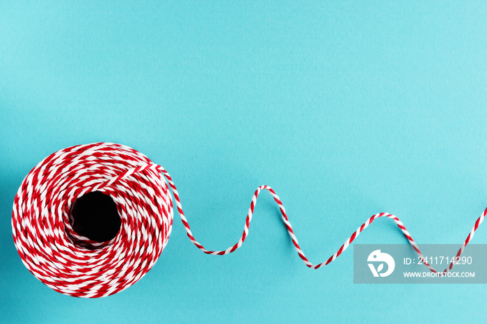 red white packing Christmas rope on blue background