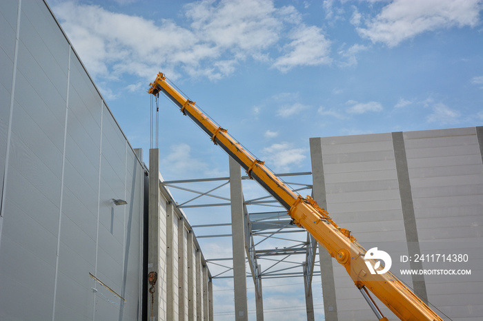 Boom of mobile crane with blue sky background.