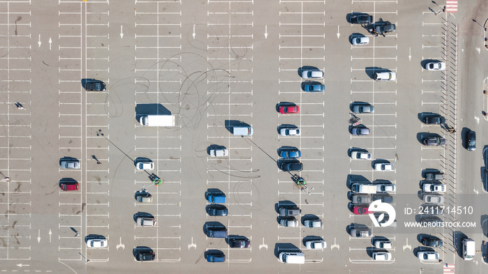 Parking lot with many cars aerial top drone view from above, city transportation and urban concept