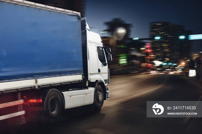 Fast truck on a city road delivering at night