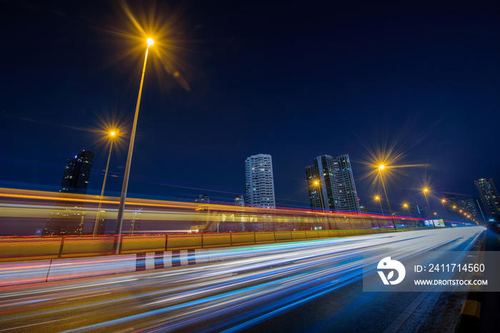 Long exposure shutter speed of car moving in road