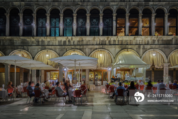 Exterior of historic cafè on St Mark’s Square at night, Venice, Italy