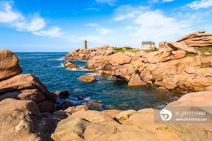 Seascape on the Pink Granite Coast in northern Brittany on the municipality of Perros-Guirec, France, with the Ploumanac’h lighthouse, named Mean Ruz and made of the same pink granite.