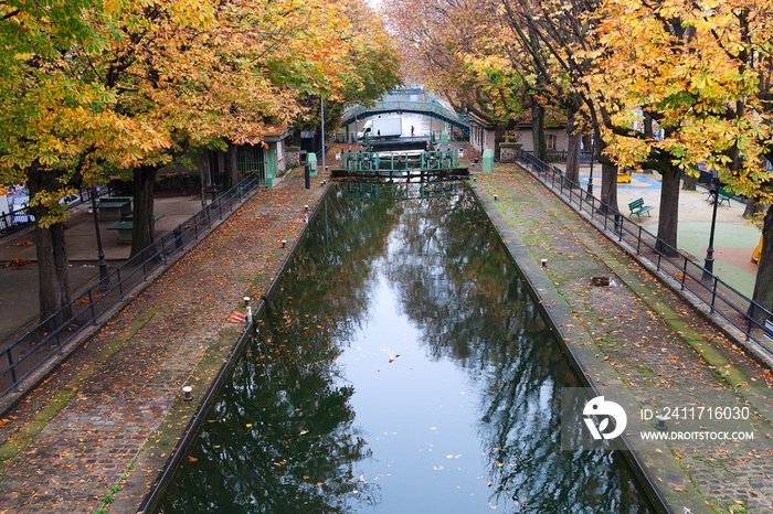 Autumn by Saint Martin canal in Paris, France.