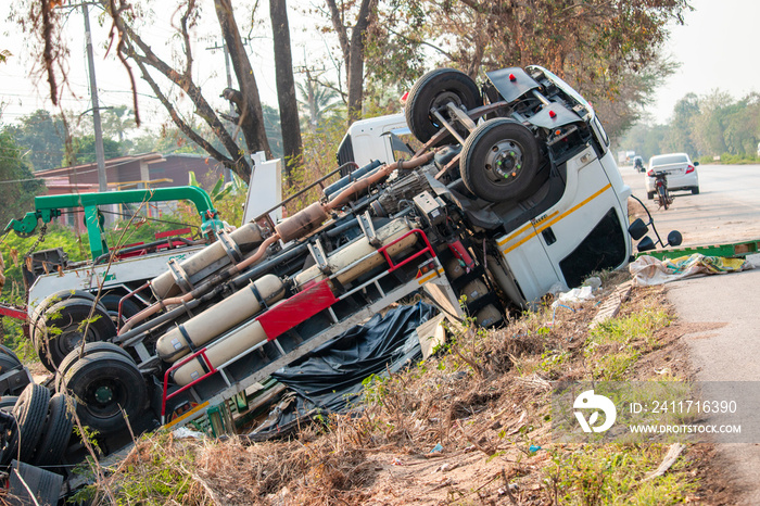 Truck accident. Truck lies on the road after incident.