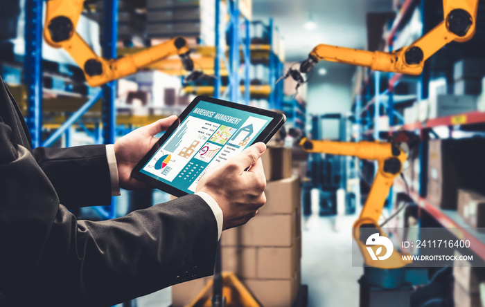 Smart robot arm systems for innovative warehouse and factory digital technology . Automation manufacturing robot controlled by industry engineering using IOT software connected to internet network .