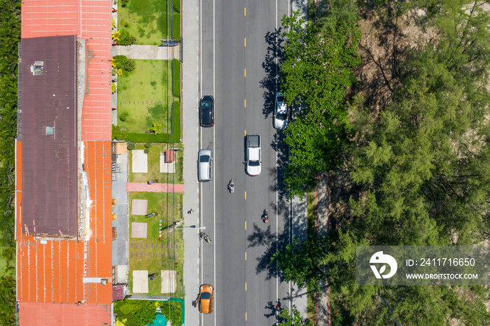 Aerial view of car and pick up truck and motorbike on road