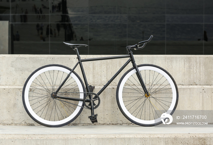 Modern bicycle parked on city street