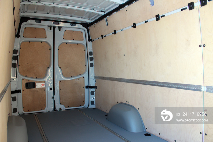 Trunk of a modern cargo van. Interior of a modern cargo van. Cargo van open trunk.